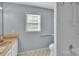 This bathroom has a neutral color scheme, hexagon tile flooring, and a white shower at 2326 Horseshoe Bend Ne Rd, Hickory, NC 28601