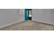 Bedroom with gray carpet and a bright turquoise door at 2326 Horseshoe Bend Ne Rd, Hickory, NC 28601