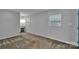 Spacious carpeted bedroom with dual windows and attached vanity at 2326 Horseshoe Bend Ne Rd, Hickory, NC 28601