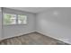 Neutral bedroom featuring carpeted floors and a bright window at 2326 Horseshoe Bend Ne Rd, Hickory, NC 28601