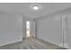 Bedroom with light grey walls and carpet, closet doors at 2326 Horseshoe Bend Ne Rd, Hickory, NC 28601