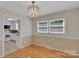 This dining room features hardwood floors, crown molding, and chandelier at 2326 Horseshoe Bend Ne Rd, Hickory, NC 28601
