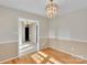 View of a dining room with hardwood floors and a decorative chandelier at 2326 Horseshoe Bend Ne Rd, Hickory, NC 28601