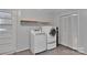 Laundry room with shelving and modern washer and dryer at 2326 Horseshoe Bend Ne Rd, Hickory, NC 28601