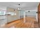 Bright, open-concept living area showcasing hardwood floors and a pass-through to the kitchen at 2326 Horseshoe Bend Ne Rd, Hickory, NC 28601