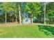 Exterior shot of the shed in the yard surrounded by a green lawn at 2326 Horseshoe Bend Ne Rd, Hickory, NC 28601