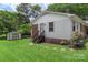 Charming home with brick accents, shed, and manicured lawn with stone walkway to backyard at 2536 Cambridge Dr, Lancaster, SC 29720
