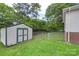 Spacious backyard featuring a well-maintained shed and secure fencing, perfect for outdoor activities at 2536 Cambridge Dr, Lancaster, SC 29720