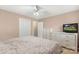 Serene bedroom with neutral carpeting, a comfortable bed, and a view of the backyard from the window at 2536 Cambridge Dr, Lancaster, SC 29720
