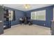 Navy bedroom featuring a ceiling fan, natural light, and a desk perfect for any work or gaming at 2536 Cambridge Dr, Lancaster, SC 29720