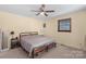Comfortable bedroom features a ceiling fan, neutral carpeting, and a cozy bed with simple furnishings at 2536 Cambridge Dr, Lancaster, SC 29720