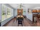 Open dining area with fireplace, wood floors, and seamless flow into the modern kitchen at 2536 Cambridge Dr, Lancaster, SC 29720