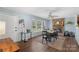 Dining room with fireplace, wood floors, and ample natural light at 2536 Cambridge Dr, Lancaster, SC 29720