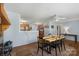 Open dining area with fireplace, wood floors, and seamless flow into the kitchen at 2536 Cambridge Dr, Lancaster, SC 29720