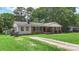 Ranch-style home featuring a spacious front yard and mature trees at 2536 Cambridge Dr, Lancaster, SC 29720