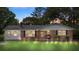 Charming brick home with manicured lawn, featuring updated lighting and inviting front porch at 2536 Cambridge Dr, Lancaster, SC 29720