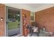 Cozy front porch with rocking chair, welcome sign, and brick accents at 2536 Cambridge Dr, Lancaster, SC 29720