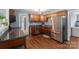 Bright kitchen features stainless steel appliances, wood cabinets, and sleek countertops at 2536 Cambridge Dr, Lancaster, SC 29720