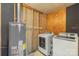 Laundry room featuring a washer, dryer, and a water heater at 2536 Cambridge Dr, Lancaster, SC 29720