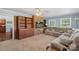 Cozy living room showcases a brick accent wall with built-in shelving, complemented by a comfortable sectional sofa at 2536 Cambridge Dr, Lancaster, SC 29720