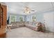 Spacious living room features plush sectional sofa, neutral carpeting, and sun-filled windows, creating a welcoming atmosphere at 2536 Cambridge Dr, Lancaster, SC 29720