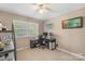 Bright home office featuring neutral carpeting, a large window, and a functional desk setup for remote work at 2536 Cambridge Dr, Lancaster, SC 29720