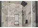 Modern tiled combination shower with sleek black fixtures and a built-in niche at 2536 Cambridge Dr, Lancaster, SC 29720