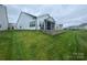 The property has a nicely landscaped backyard with a screened porch and retaining wall at 25952 Appleyard Ct, Lancaster, SC 29720