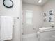 A calming, well-lit bathroom with a decorative clock, artwork, and a toilet at 25952 Appleyard Ct, Lancaster, SC 29720