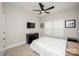 Comfortable bedroom features a ceiling fan, plush carpeting, and a black dresser for storage at 25952 Appleyard Ct, Lancaster, SC 29720