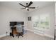 Cozy bedroom with a ceiling fan, plush carpeting, and a built-in shelving unit beneath the window at 25952 Appleyard Ct, Lancaster, SC 29720
