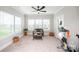 Versatile bonus room with natural light, exercise equipment, and cozy seating for relaxation and fitness at 25952 Appleyard Ct, Lancaster, SC 29720