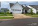 Well-maintained home with 2-car garage, dormer windows, and landscaped front yard at 25952 Appleyard Ct, Lancaster, SC 29720