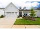 Charming single-story home featuring a well-manicured lawn and attached two-car garage at 25952 Appleyard Ct, Lancaster, SC 29720