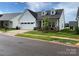 Traditional single-Gathering home with attached garage, dormer windows, and neatly landscaped yard at 25952 Appleyard Ct, Lancaster, SC 29720