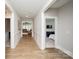 Inviting hallway featuring stylish wood floors, decorative molding, and neutral paint at 25952 Appleyard Ct, Lancaster, SC 29720