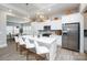 Bright kitchen featuring a large island with bar seating, pendant lighting, and stainless steel appliances at 25952 Appleyard Ct, Lancaster, SC 29720