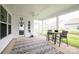 Covered patio area with ceiling fan, decorative rug, and a dining table at 25952 Appleyard Ct, Lancaster, SC 29720