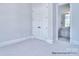 Bright bedroom with neutral carpet adjacent to private bathroom at 277 Triple Ponds Ct # 12, Clover, SC 29710