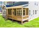 Relaxing covered porch, showcasing wood railings, ample space, and backyard views at 277 Triple Ponds Ct, Clover, SC 29710
