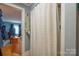 Bathroom featuring a shower with curtain and adjacent storage area at 2808 Water Plant Rd, Maiden, NC 28650