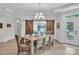 Elegant dining room features a chandelier, wood table, and decorative sliding barn doors at 3006 Constitution Ln, Gastonia, NC 28056