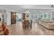 Open-concept dining area seamlessly connects to the living room, complete with wood flooring and natural light at 3006 Constitution Ln, Gastonia, NC 28056