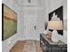 Welcoming foyer features hardwood floors and tasteful decor, including a stylish console table and artwork at 3006 Constitution Ln, Gastonia, NC 28056