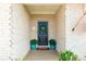 Inviting entryway with a decorative wreath on the door and vibrant potted plants at 3006 Constitution Ln, Gastonia, NC 28056