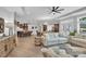 Bright, open-concept living space featuring a kitchen island, dining area, and comfortable seating at 3006 Constitution Ln, Gastonia, NC 28056
