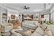 Open living space showcasing a kitchen island with barstools, dining area, and comfortable sofas at 3006 Constitution Ln, Gastonia, NC 28056