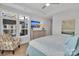 Bright bedroom featuring stylish decor, a ceiling fan, and a window with plantation shutters at 3006 Constitution Ln, Gastonia, NC 28056