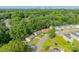 Overhead view of a neighborhood with mature trees and glimpse of the Charlotte skyline in the distance at 3608 Crestridge Dr, Charlotte, NC 28217