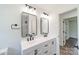 Beautiful primary bath with double vanity, two mirrors, and modern fixtures at 3608 Crestridge Dr, Charlotte, NC 28217